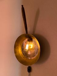 Plug in wall sconce made from antique copper ladle