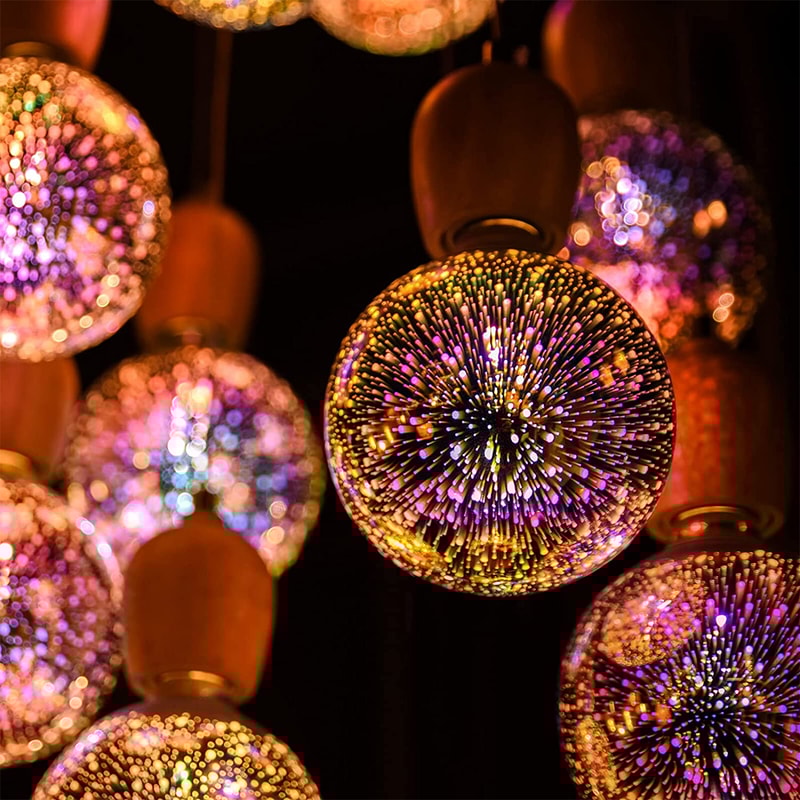 Closeup of Galaxy Light Bulb displaying intricate 3D galaxy patterns