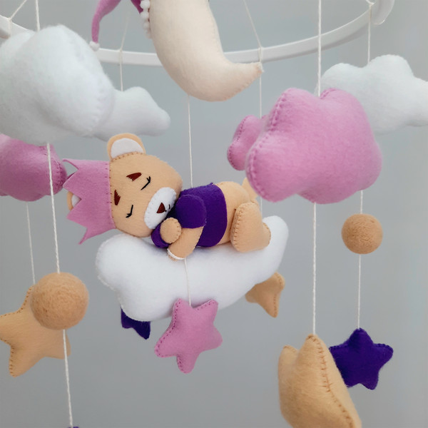 Crib mobile with teddy bear.png