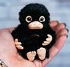 Tiny-baby-Niffler-toy-2-scaled.jpg