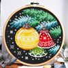 This is a cross stitch pattern with Christmas decorations on the Christmas tree.