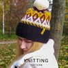 Knitted-jacquard-hat-with-a-pompom-1