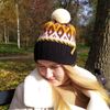 Knitted-jacquard-hat-with-a-pompom-2