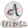 Cross stitch alphabet, letter a with flowers, canvas aida fabrick and round hoop.jpg