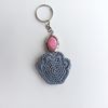 Crochet_Cat_Paw_on_a_White_Background_with_a_Pink_Keychain_5.jpg