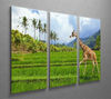 The giraffe goes on a green grass against mountains 3 Split Panel Canvas Print