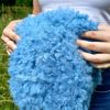 Cute bucket hat. Style curly hat. Bright blue fluffy fur panama hat.