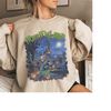 MR-99202310959-the-haunted-mansion-retro-comic-sweatshirt-horrificland-image-1.jpg