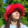 Red ruby faux fur bucket hat. Stylish fluffy hat for festivals and every day.