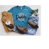 MR-4102023113310-promoted-to-daddy-est-2023-shirt-baby-announcement-tee-image-1.jpg