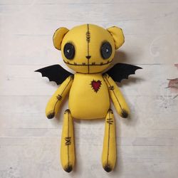 handmade stuffed bear with bat wings