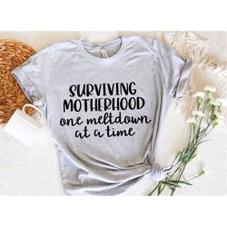 urviving motherhood one meltdown at a time t shirt funny mom
