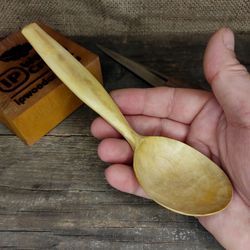 handmade wooden spoon from natural maple wood with comfortable handle for eating