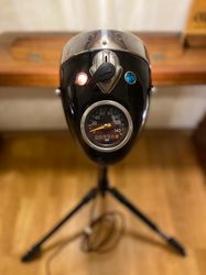 lamp on tripod made from headlight of the soviet motorcycle