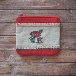 cosmetic bag with embroidered mushrooms