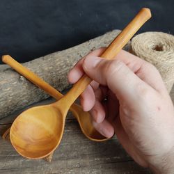 handmade wooden spoon from natural birch wood for eating or serving