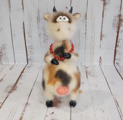 the cow is crocheted.handmade work.an original gift to a loved one.interior design.interior toy.knit