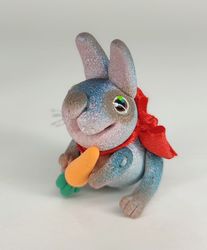 blue miniature bunny with a carrot. animal miniature. rabbit toy. collectible toy. collectible figurine. gift ideas.