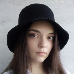 stylish, fashion black bucket hat for women. luxury designer hat made of unisex cotton. a mod handmade bucket  hat.