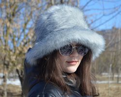 arctic fox bucket hat made of faux fur. furry bucket hat. gray white fluffy bucket hat. cute fuzzy winter fox hat.