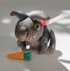 black miniature bunny with a carrot. animal miniature. rabbit toy. collectible toy. collectible figurine. gift ideas.