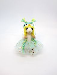 miniature needle felted mouse in an owl hat and a tutu