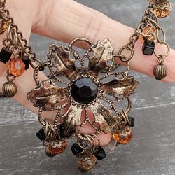 necklace of flowers with chains necklace. bronze fittings, in boho styles. bohemian accessories vintage style, business,