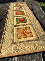 fall quilted table runner with leaves, autumn entryway table decor, quilt table runner in autumn colors, dresser scarf