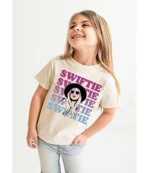 kid swiftie shirt, kid swiftie merch, swiftie kid youth outfits, taylor swiftie merch, eras tour movie shirt, gift for s
