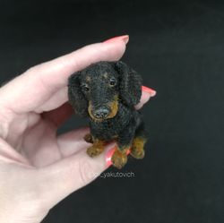 black dachshund. miniature decorative dachshund. crocheted dog sausage gift. the dachshund is a souvenir. oxyakutovich