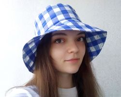 checkered bucket hat. cute summer hat for women. a fashion hat for traveling in checkers. plaid blue and white sun hat.