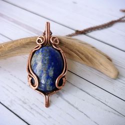 wire wrapped lapis lazuli necklace. wire weave copper pendant with blue lapis lazuli stone.