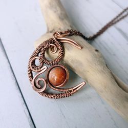 sunstone necklace. wire wrapped crescent moon necklace with sunstone bead.