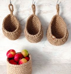 set of hanging jute baskets storage in the kitchen and bathroom, crocheted wall baskets, boho decor rustic country house