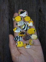 collection of various miniature clay butterflyfish of the world, tiny fish for diorama or dollhouse aquarium