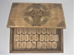 Rune set of Elder Futhark in a box with a hidden lock Secret of Celtic Cross. Wooden runes in a box with puzzle lock.