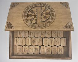 Rune set of Elder Futhark in a box with a hidden lock Secret of Helm of Awe. Wooden runes in a box with puzzle lock.