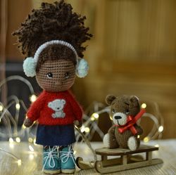 crochet doll with christmas sleigh and teddy bear