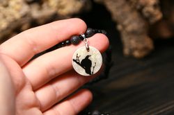 raven or crow necklace with love rune on the other side. nacre pearl pendant