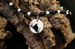 raven or crow necklace with love rune on the other side. nacre pearl pendant