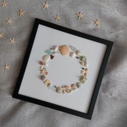 circle of shells and sea glass. coastal round wreath. small round wreath. shell art. sea glass art.