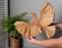 wall decor bird. wicker bird with raffia. hanging handmade decor for the living room.