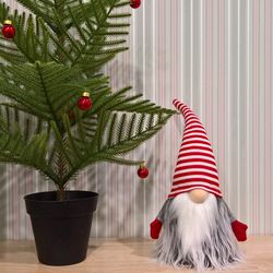 christmas gnome in striped hat, nordic xmas home decoration scandinavian tomte