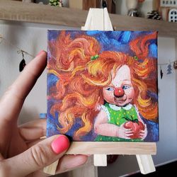 miniature oil painting.  focus on the good painting.  funny clown.  hand painting. optimistic painting. small painting.