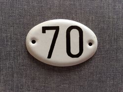 black white apartment 70 address door number sign