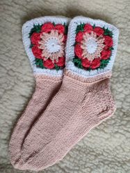 beautiful warm hand knitted wool socks with a flower