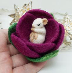 miniature needle felted mouse sleeping in a flower