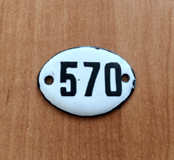 white black oval address number sign 570 apartment plaque vintage