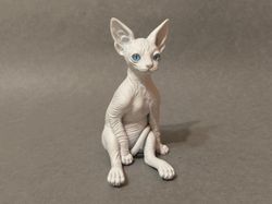 baby sphynx cat sculpture white realistic eyes.