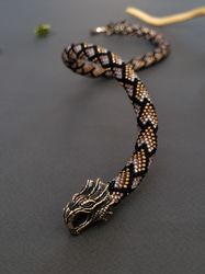 dragon necklace made of beads and bronze